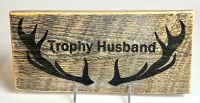 Sign, Trophy Husband